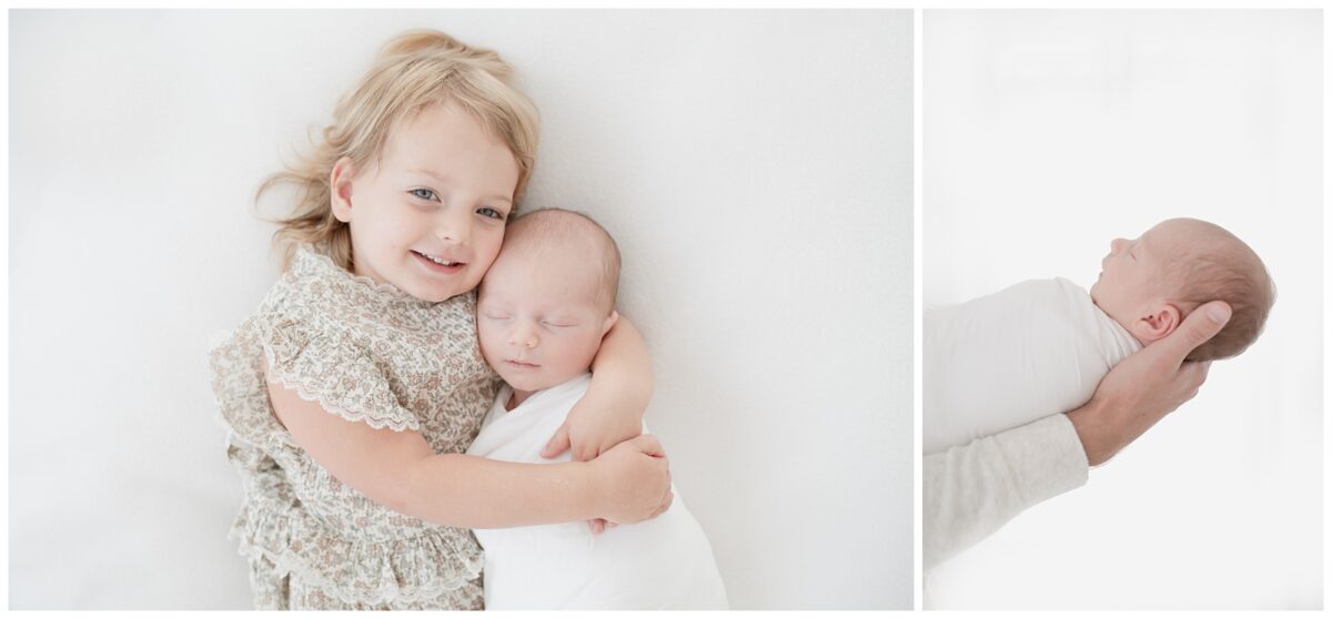 bis sister holding her baby brother in studio newborn session