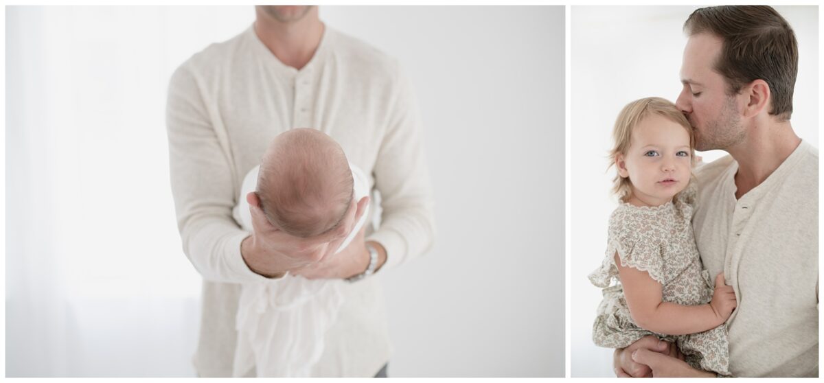 dad holding newborn baby boy